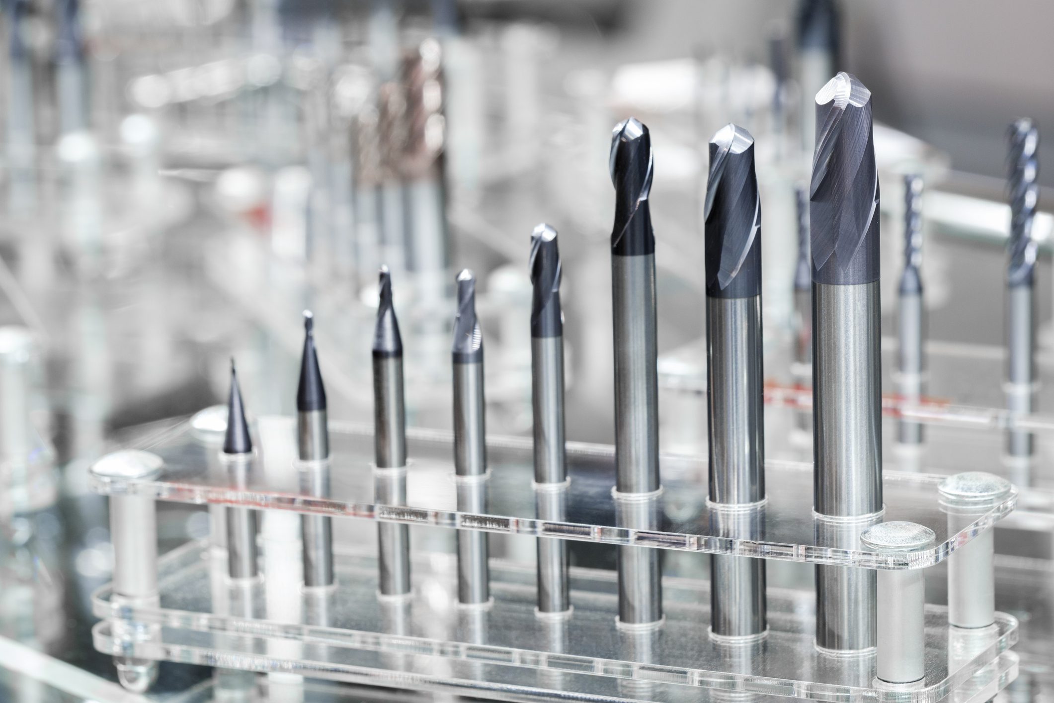 Various metal drill bits on display rack.