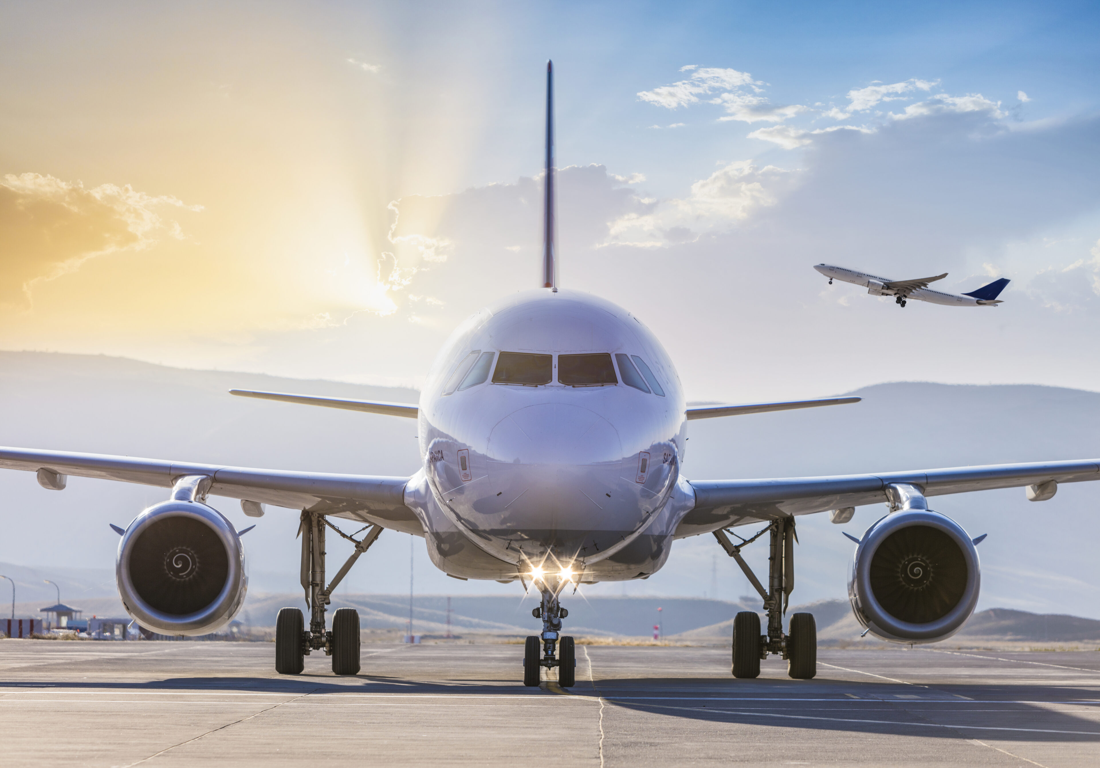 Front view of a passenger airplane on runway before take off